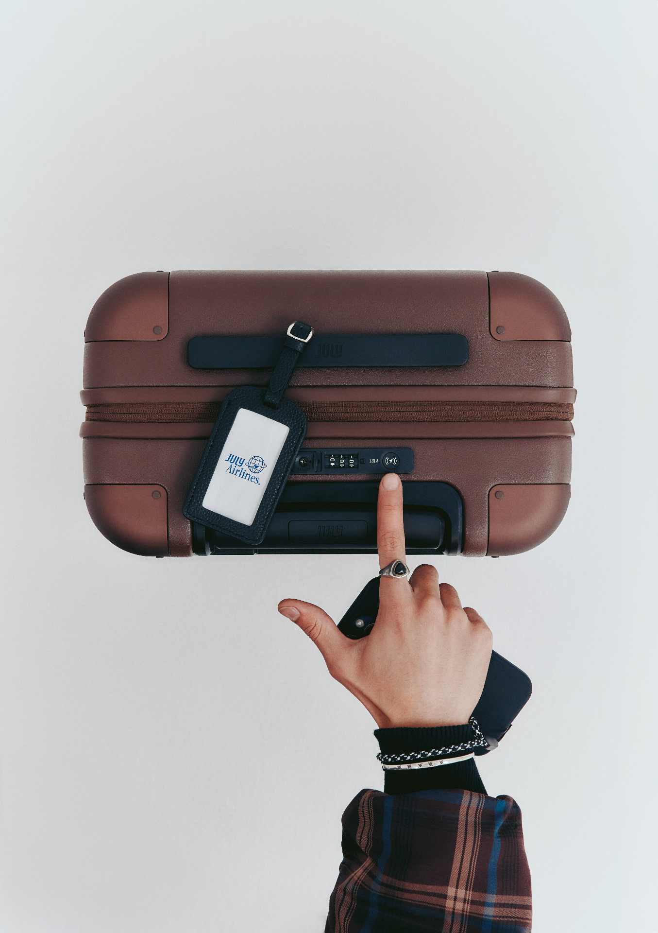 Traveler interacting with smart luggage lock module
